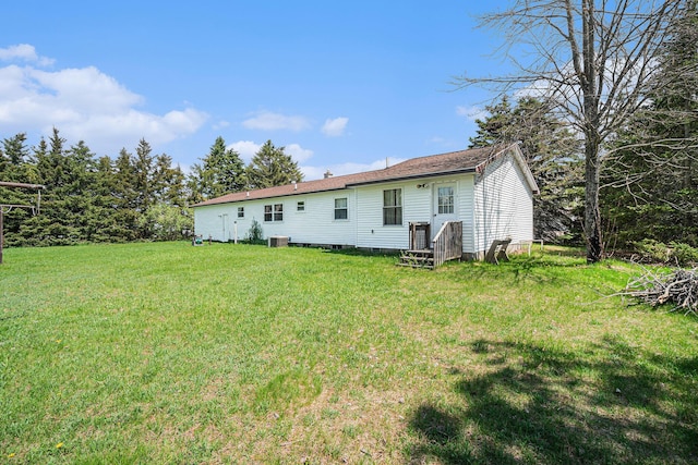 1114 Brooktrout Ln, Gaylord, MI 49735 - rear view of property with a yard and cooling unit