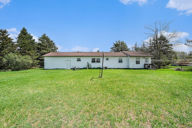 1114 Brooktrout Ln, Gaylord, MI 49735 - back of house with a lawn