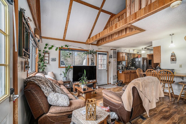 4421 Kimball Ave, Gaylord, MI 49735 - living room featuring dark wood-type flooring, a ceiling fan, and lofted ceiling with beams