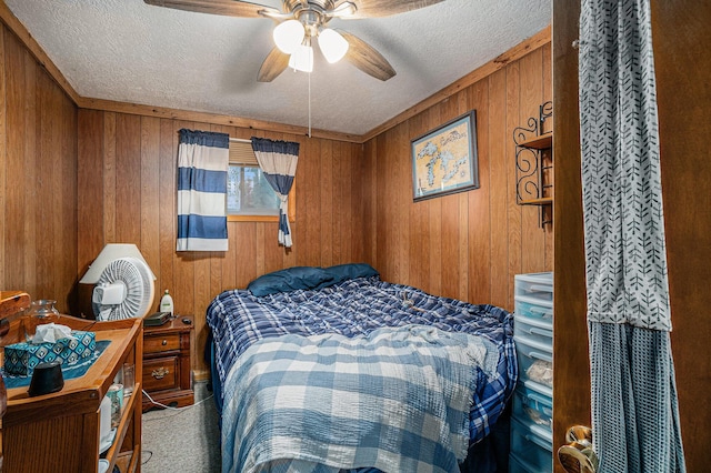 4421 Kimball Ave, Gaylord, MI 49735 - bedroom featuring wooden walls, a textured ceiling, and ceiling fan