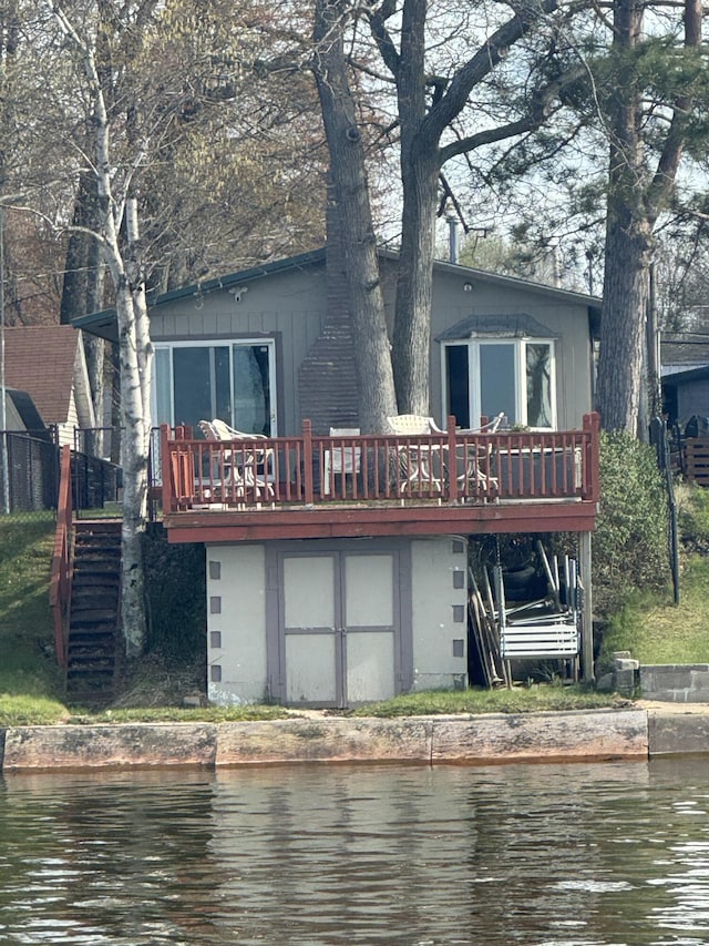 1504 Houghton View Dr, Houghton Lake, MI 48629 - back of property featuring a deck with water view