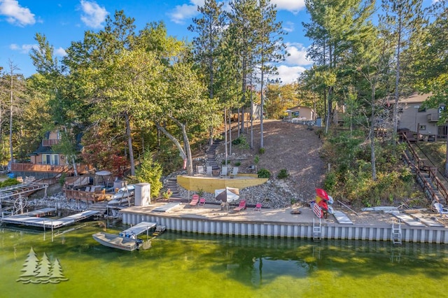 6122 Beach Rd, Johannesburg, MI 49751 - view of dock with a patio and a water view