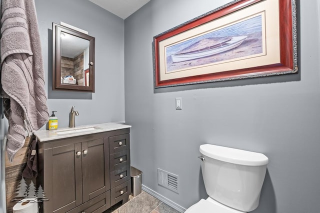 6122 Beach Rd, Johannesburg, MI 49751 - half bathroom featuring visible vents, toilet, and vanity