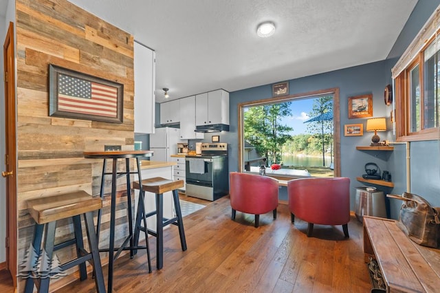 6122 Beach Rd, Johannesburg, MI 49751 - interior space featuring light wood-style flooring and a textured ceiling