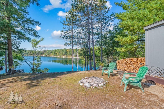 6122 Beach Rd, Johannesburg, MI 49751 - view of yard with a water view