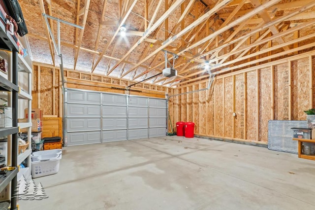 3211 Jenson St, Lewiston, MI 49756 - garage featuring a garage door opener