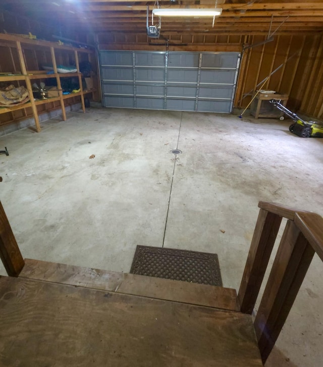 638 Old Trail Dr, Houghton Lake, MI 48629 - garage with a garage door opener