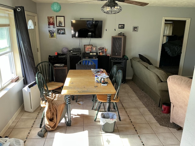 2007 M30, Gladwin, MI 48624 - dining area featuring a ceiling fan, light tile patterned floors, and baseboards