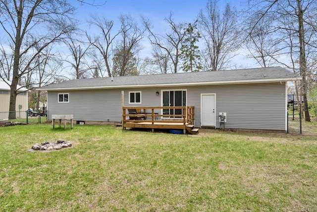 6830 Elmwood, Indian River, MI 49749 - back of house featuring a deck and an outdoor fire pit