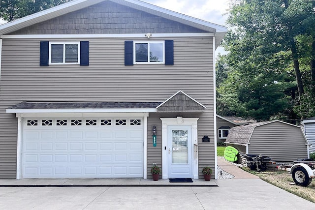 605 Sam-O-Set Blvd, Roscommon, MI 48653 - traditional-style home with concrete driveway and a garage