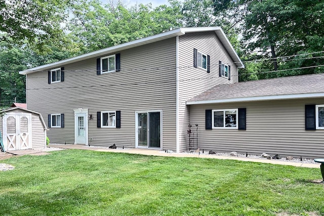 605 Sam-O-Set Blvd, Roscommon, MI 48653 - back of property with an outbuilding, a lawn, and a storage shed
