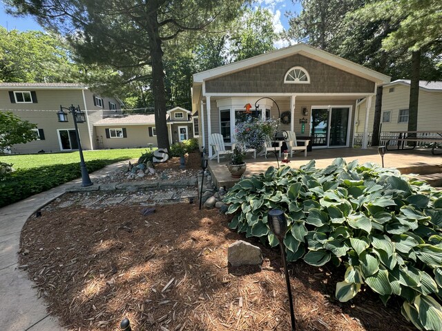 605 Sam-O-Set Blvd, Roscommon, MI 48653 - exterior space with a lawn and covered porch