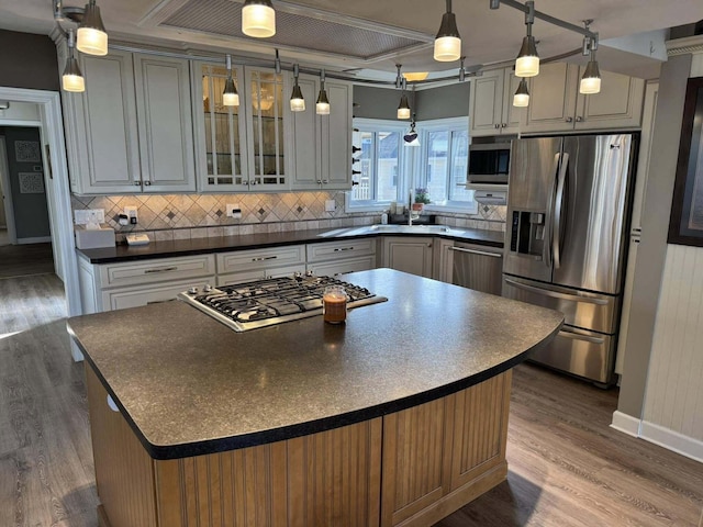 605 Sam-O-Set Blvd, Roscommon, MI 48653 - kitchen with dark countertops, stainless steel appliances, and decorative backsplash