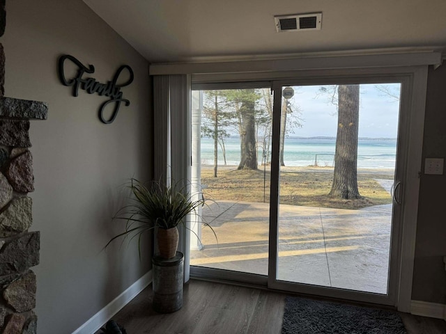 605 Sam-O-Set Blvd, Roscommon, MI 48653 - entryway with baseboards, a water view, visible vents, and wood finished floors