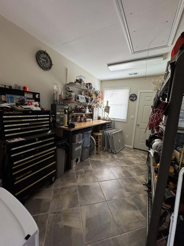 605 Sam-O-Set Blvd, Roscommon, MI 48653 - misc room with visible vents, tile patterned flooring, a workshop area, and attic access