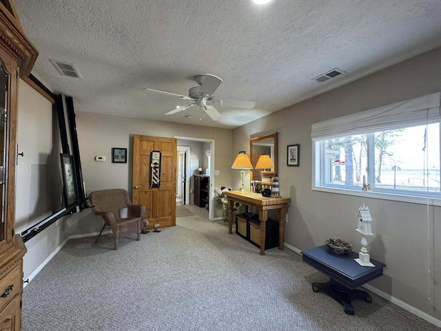 605 Sam-O-Set Blvd, Roscommon, MI 48653 - sitting room featuring a ceiling fan, light carpet, baseboards, and visible vents