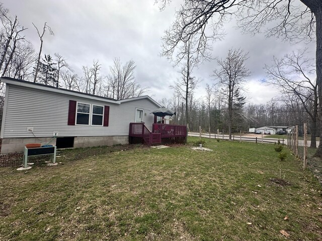 5128 Krys Rd, Gaylord, MI 49735 - view of yard with fence and a wooden deck