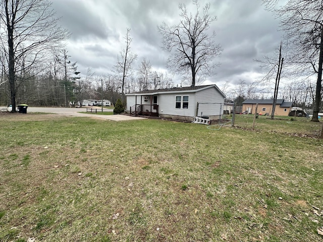 5128 Krys Rd, Gaylord, MI 49735 - exterior space with a front lawn