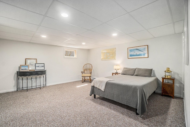 carpeted bedroom with recessed lighting, a drop ceiling, and baseboards