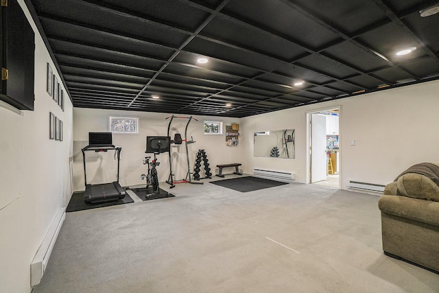 workout room featuring a baseboard heating unit, baseboard heating, and recessed lighting