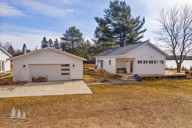 4565 Grant Dr, Lewiston, MI 49756 - ranch-style home featuring a detached garage, an outbuilding, and a front lawn