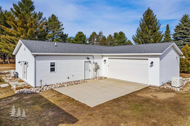 4565 Grant Dr, Lewiston, MI 49756 - garage featuring concrete driveway