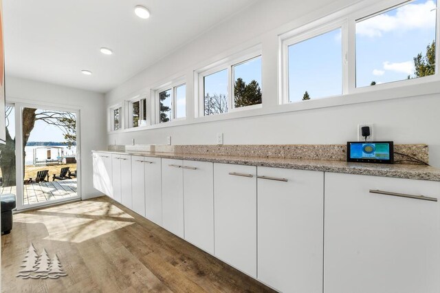 4565 Grant Dr, Lewiston, MI 49756 - bar featuring wood finished floors and recessed lighting