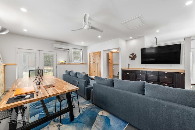 4565 Grant Dr, Lewiston, MI 49756 - living area with recessed lighting, a wall unit AC, french doors, attic access, and ceiling fan