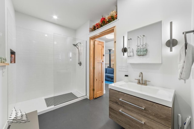 4565 Grant Dr, Lewiston, MI 49756 - full bath with visible vents, finished concrete flooring, vanity, and a walk in shower