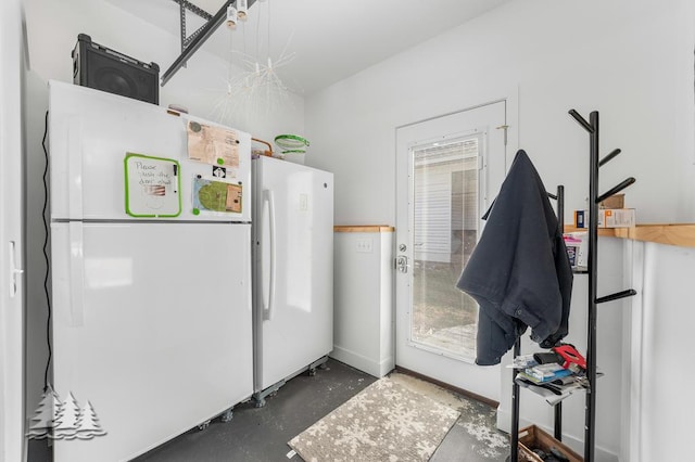 4565 Grant Dr, Lewiston, MI 49756 - interior space with freestanding refrigerator and concrete floors