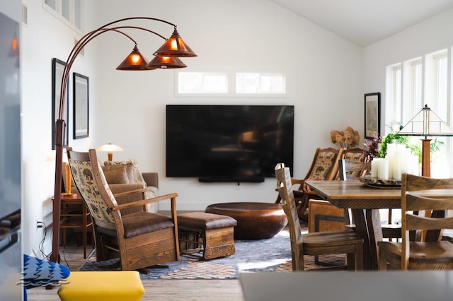 4565 Grant Dr, Lewiston, MI 49756 - living area featuring vaulted ceiling and wood finished floors