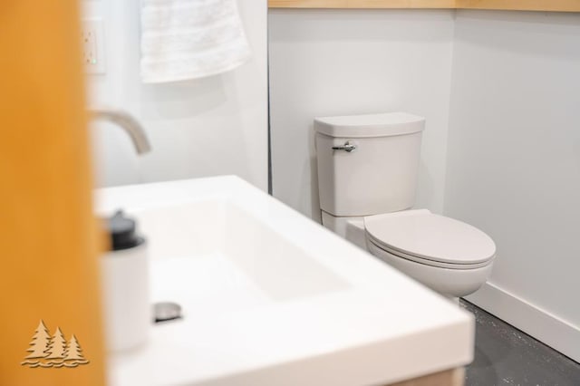 4565 Grant Dr, Lewiston, MI 49756 - bathroom with toilet and baseboards