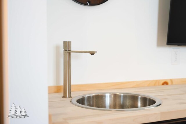4565 Grant Dr, Lewiston, MI 49756 - room details featuring light countertops and a sink