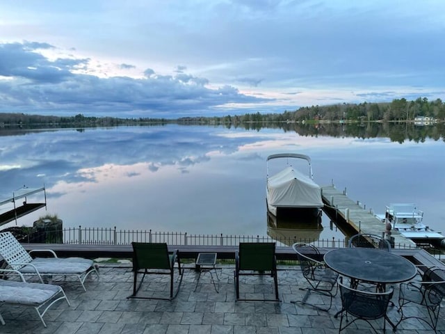14150 Pointe Rd, Atlanta, MI 49709 - view of patio / terrace with a water view and a grill