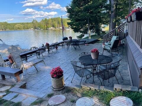 14150 Pointe Rd, Atlanta, MI 49709 - view of patio with a water view and a forest view