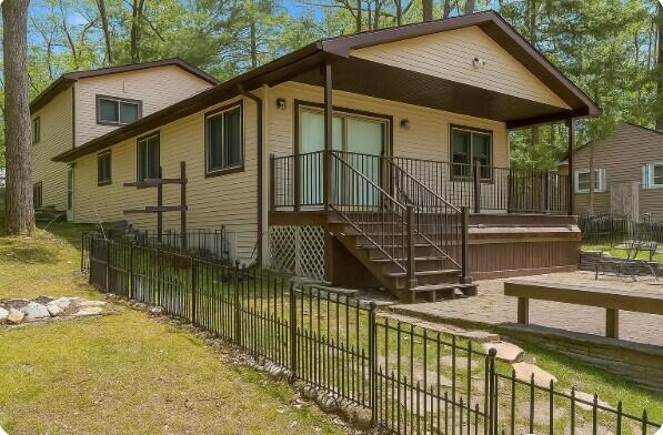 14150 Pointe Rd, Atlanta, MI 49709 - view of front of home featuring covered porch and stairway