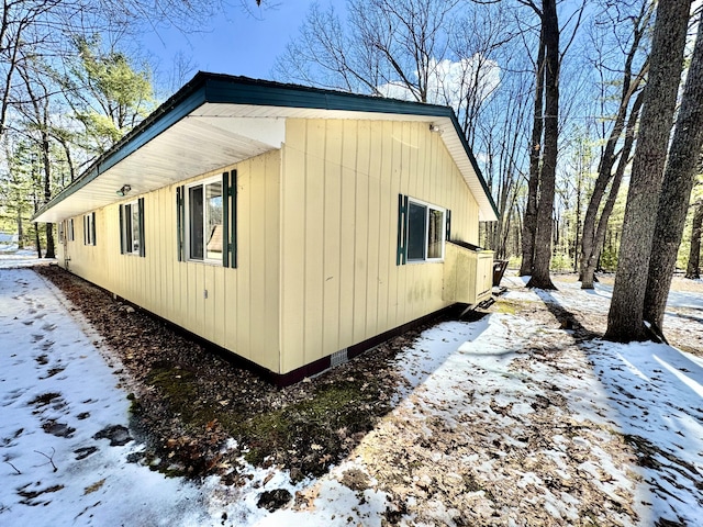 1570 E College Dr, Lewiston, MI 49756 - snow covered property with crawl space
