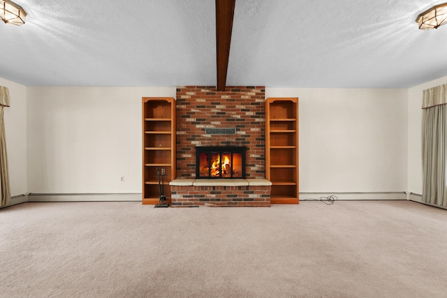 1384 W Higgins Lake Dr, Roscommon, MI 48653 - unfurnished living room featuring a textured ceiling, a baseboard heating unit, carpet flooring, beamed ceiling, and a brick fireplace