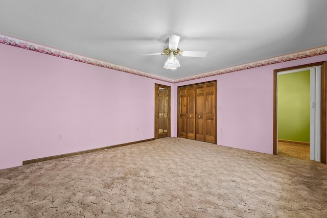 1384 W Higgins Lake Dr, Roscommon, MI 48653 - unfurnished bedroom featuring carpet floors, a closet, and ceiling fan