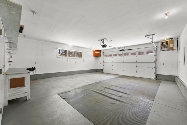 1384 W Higgins Lake Dr, Roscommon, MI 48653 - garage featuring a garage door opener