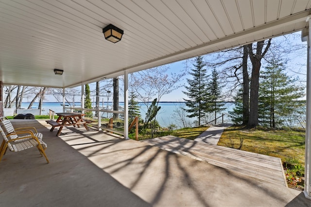 1384 W Higgins Lake Dr, Roscommon, MI 48653 - view of patio with a water view