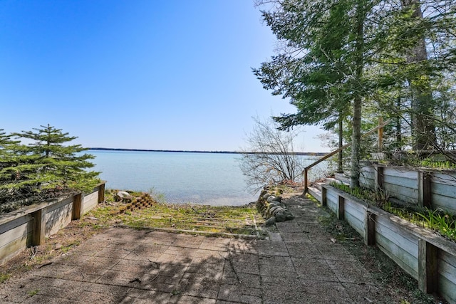 1384 W Higgins Lake Dr, Roscommon, MI 48653 - dock with a water view and fence