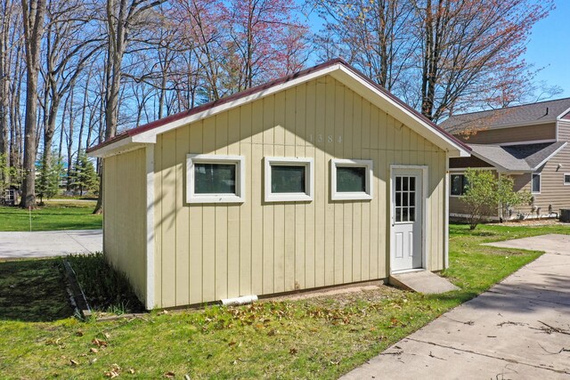 1384 W Higgins Lake Dr, Roscommon, MI 48653 - view of outbuilding featuring central air condition unit