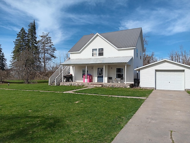 2960 Birch St, Johannesburg, MI 49751 - view of front of house featuring an outbuilding, covered porch, a front yard, and concrete driveway