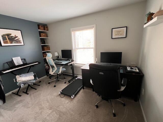 home office featuring carpet and baseboards