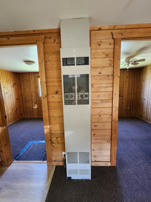 11359 Polaris St, Saint Helen, MI 48656 - interior space featuring a heating unit, wooden walls, and carpet floors