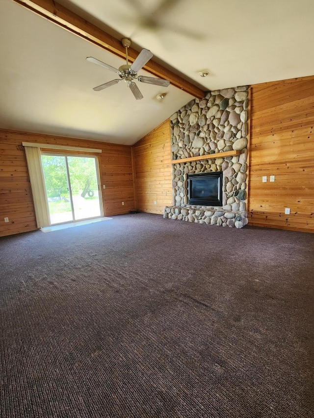 11359 Polaris St, Saint Helen, MI 48656 - unfurnished living room featuring wooden walls, ceiling fan, a fireplace, and carpet