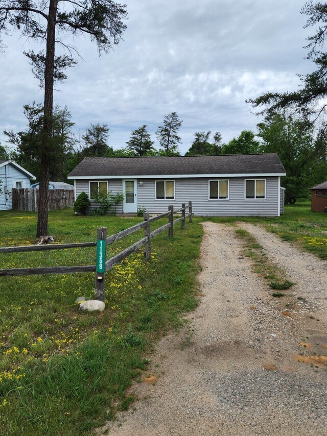 11359 Polaris St, Saint Helen, MI 48656 - ranch-style home featuring dirt driveway and a shingled roof