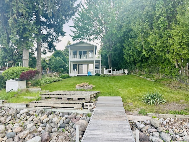 6382 W Higgins Lake Dr, Roscommon, MI 48653 - rear view of property featuring a balcony
