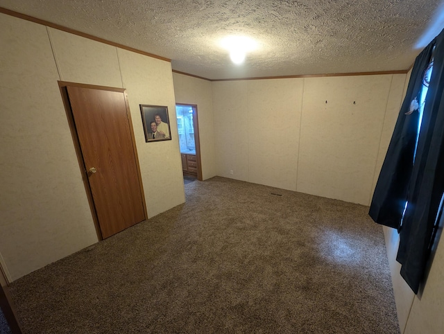20776 Tennis Rd, Hillman, MI 49746 - spare room featuring carpet floors, a textured ceiling, and crown molding